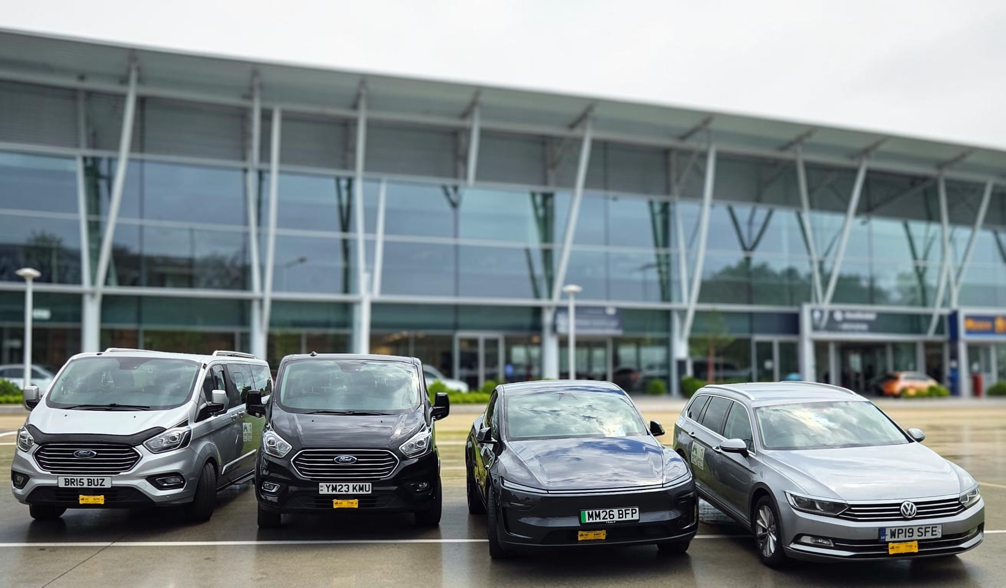 Hughes Travel fleet including minibuses and executive cars